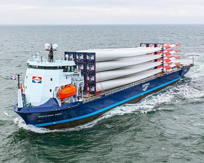 Cargo ship Southern Rock at sea carrying wind turbine blades on deck