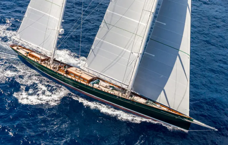 Aerial view of sailing yacht Hetairos under full sail on open sea