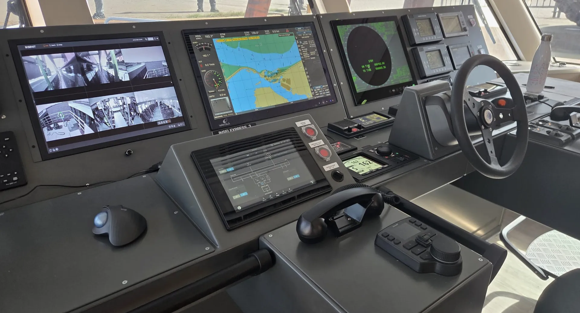 InselExpress 3 bridge console with Marble alarm and power HMI next to navigation screens